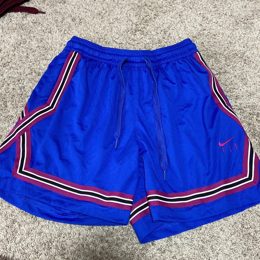 Women’s nike basketball shorts ~ Size medium ( color royal blue/ purple )